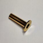 Dekoratīvā uzlika DN 40 komplektā ar dekoratīvo nosegcauruli DN 18 x L=70 mm. Dizaina sērija Fine. Virsma: spīdīga zelta tonī